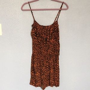 orange and black ruffled romper